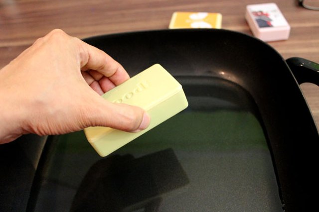 Dip the soap in the melted wax