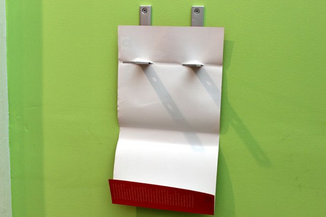 Slide the two slits into the L-brackets