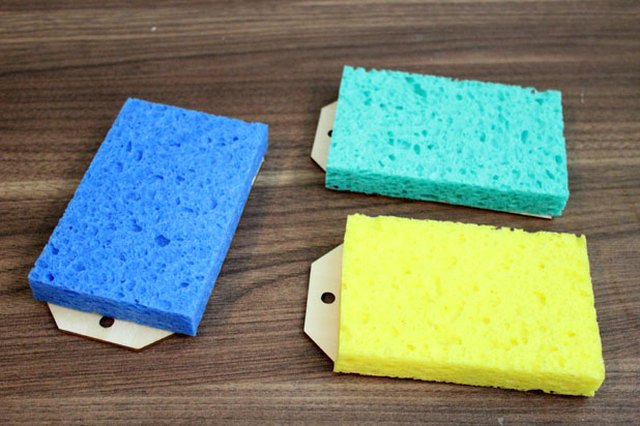 Place wet sponge on top of the paper