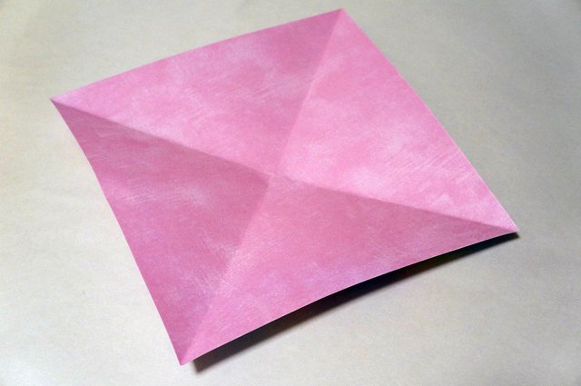 Fold both diagonals.