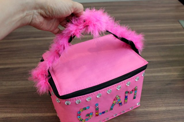 Tie a feather boa to the handle