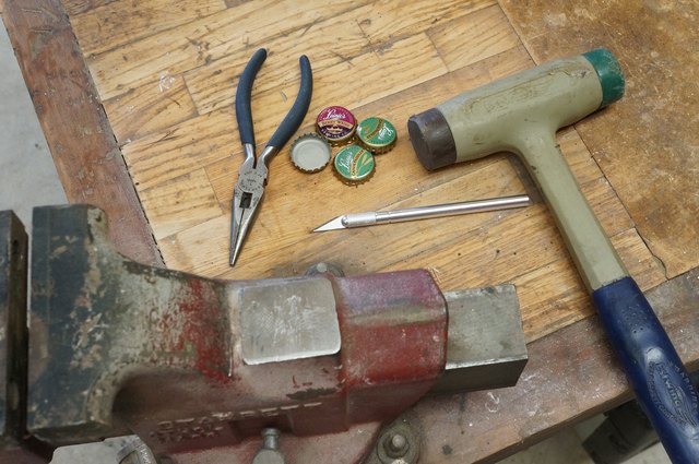 Caps, tools and working area.