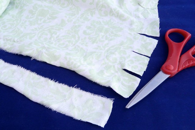 Tearing the fabric into strips
