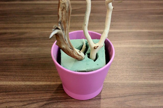 Insert branches in floral foam