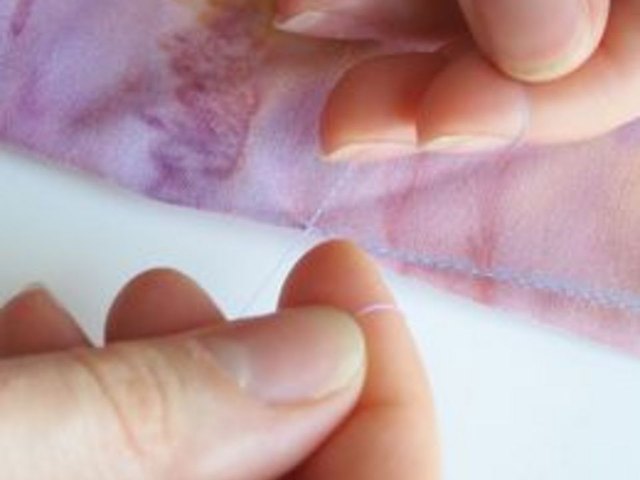 Knot thread at bottom of dart
