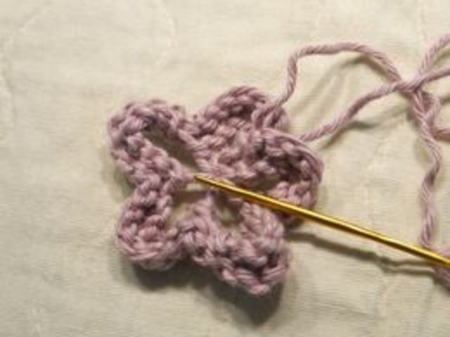 Pull the yarn tight to make a flower