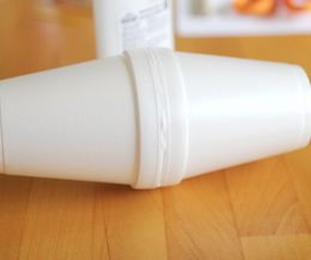 Use styrofoam glue to adhere two styrofoam cups together.