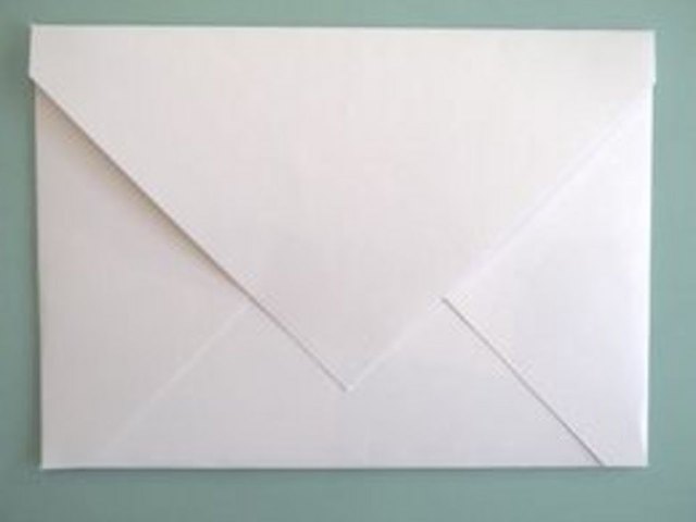 Use a glue stick to seal the envelope.
