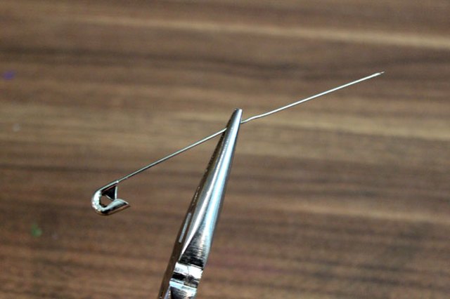 Straighten a safety pin