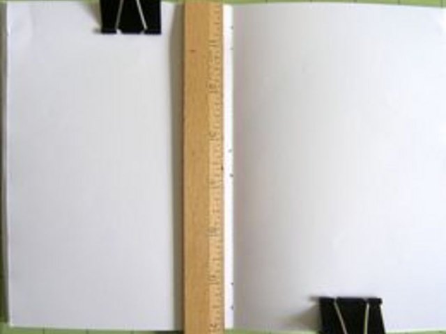 Punch marked holes with awl tool.
