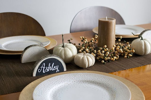 Log-slice place cards create a forest-like dinner setting.