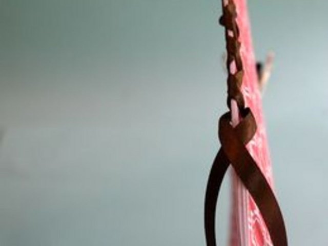 Weave ribbon down spine.
