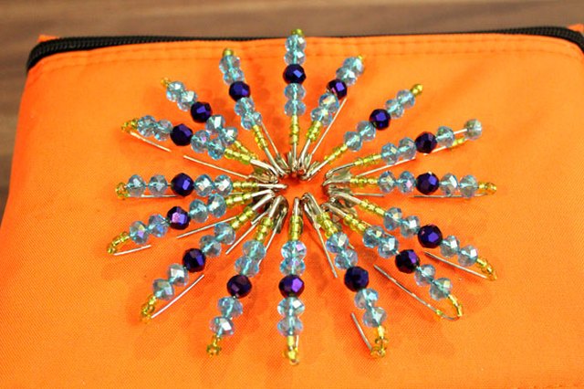 Create a pattern with the safety pins