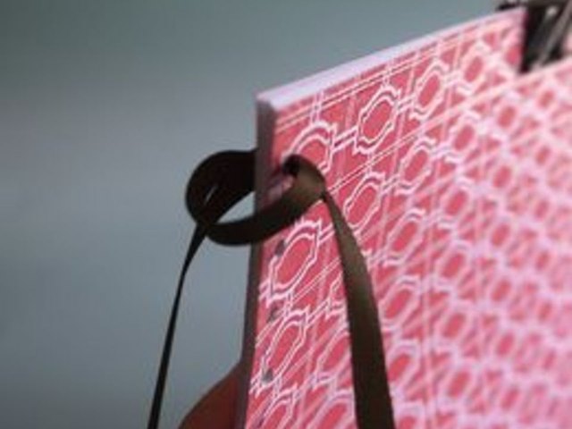 Loop ribbon through first hole.