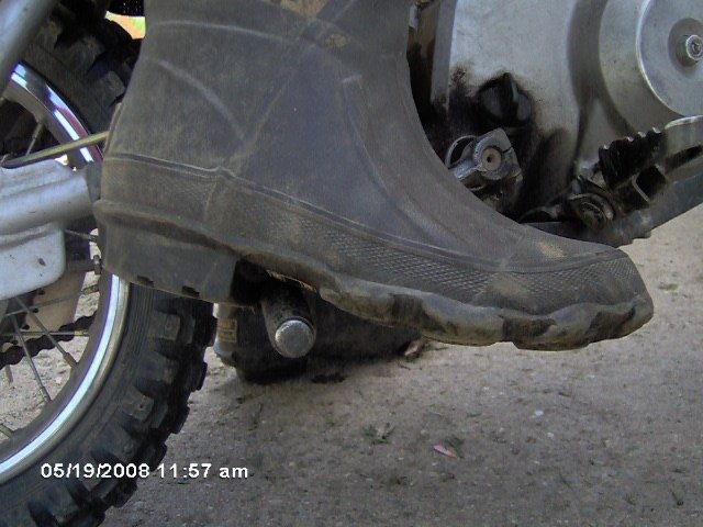 Foot on kick start peg