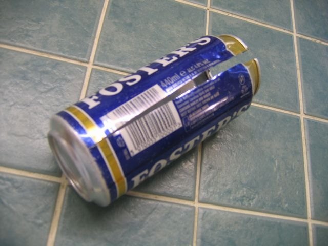 Cut down the side of the can
