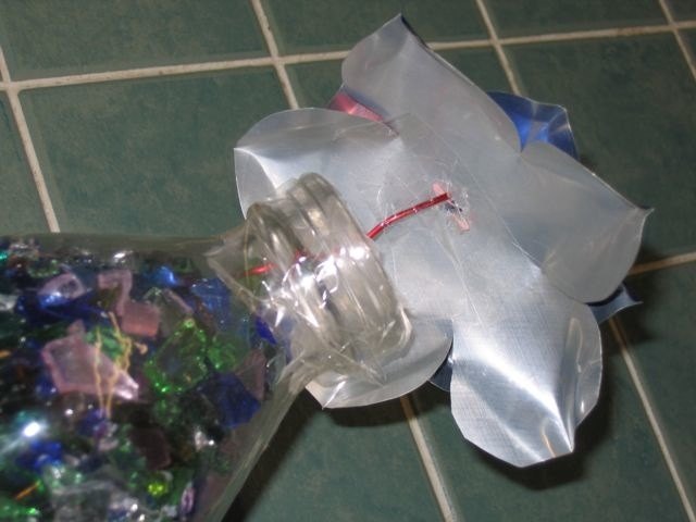 Glue or tape the flower to a wire stem