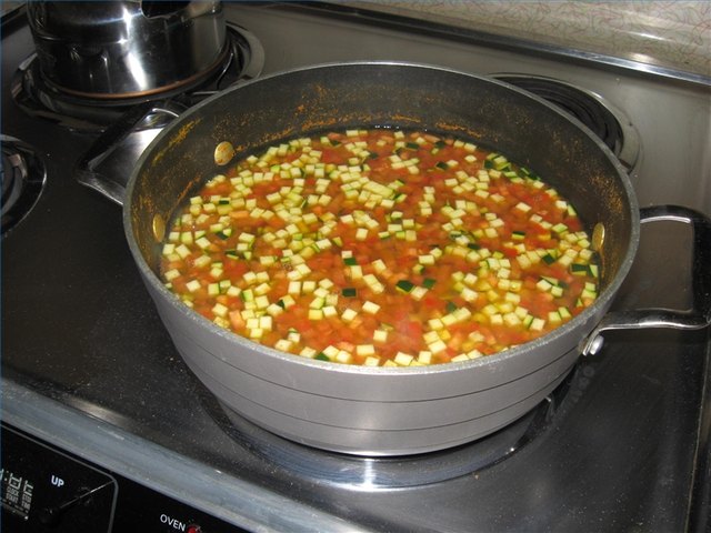 Chana cooking with tomato, zucchini