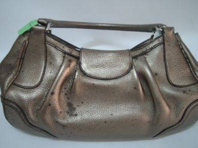 If you do not clean your coat regularly, it could end up with black mildew spots like this purse.