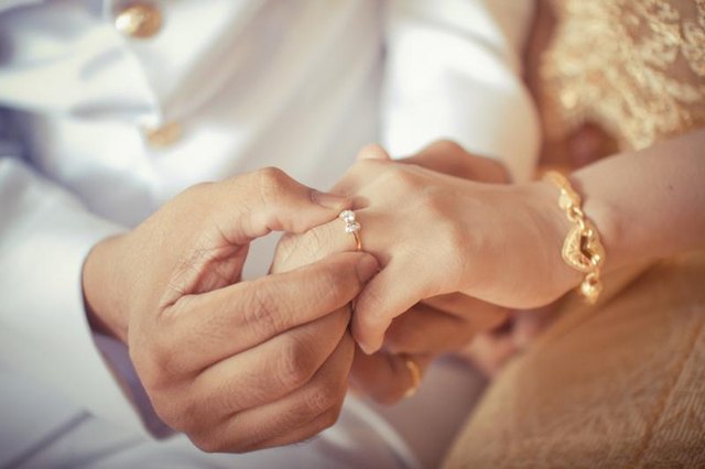A couple is taking their wedding vows.