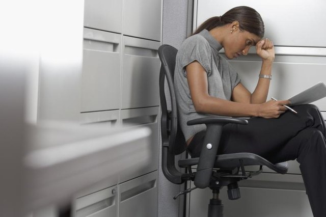 Woman with a headache at work.
