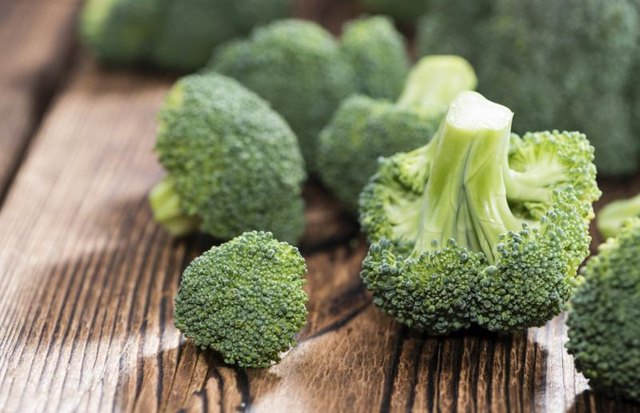 Fresh broccoli on a cutting board. Fresh broccoli on a cutting board.