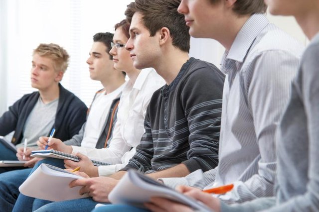 A group of college students sitting together.