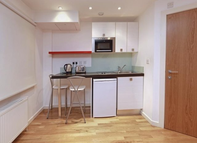 A compact apartment kitchen.