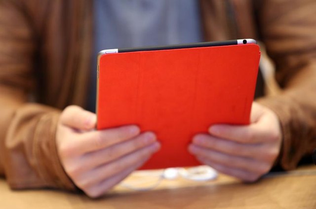 Man holding a digital tablet.
