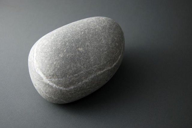Grey stone paperweight.