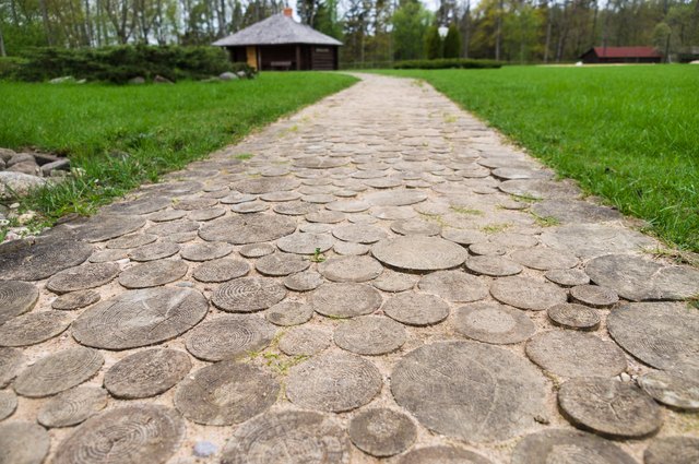 Durable and practical, wood slices bring a country vibe to the walkway.