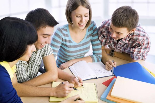 A group of college students is studying together.