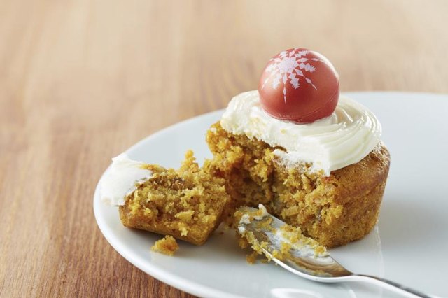 Small carrot cake serving on dessert dish.