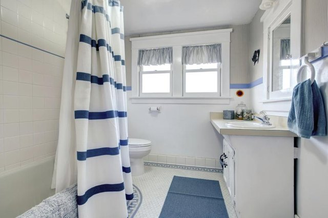 A serene bathroom with blue accessories.