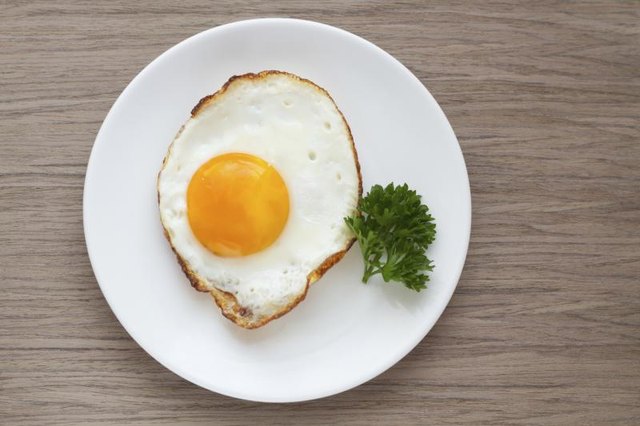 Cooked egg on a small plate. Cooked egg on a small plate.