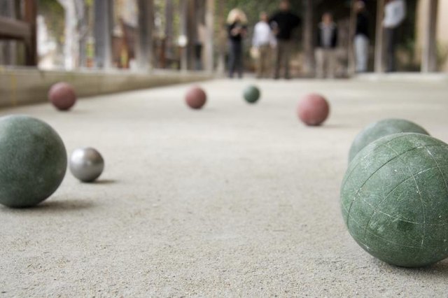 Bocci balls on a field.