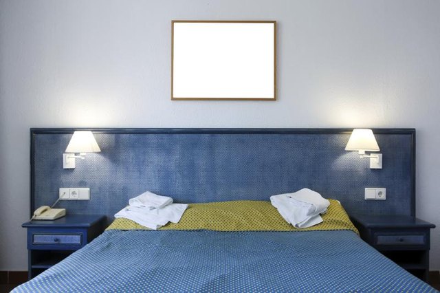 Bedroom with baby blue wall.