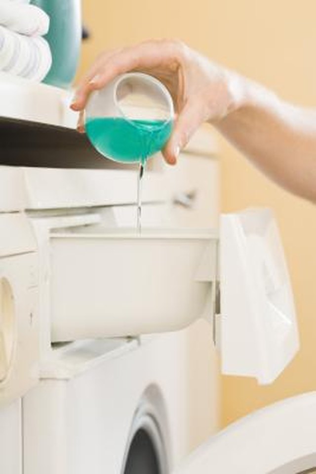 Wash your stained item after scraping off excess latex paint.