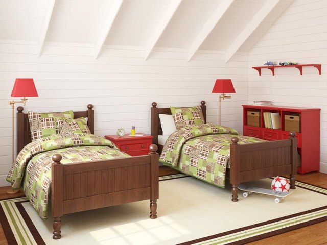 A bedroom with two twin beds in a loft. A bedroom with two twin beds in a loft.