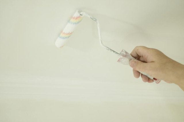 Close-up of paint roller against a ceiling