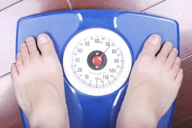 Man's feet on a scale