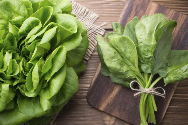 Fresh spinach on cutting a board.
