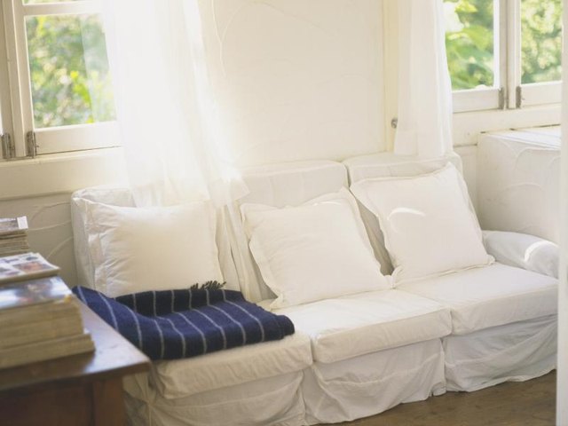 Interior of cape home with bright windows letting in lots of natural light.