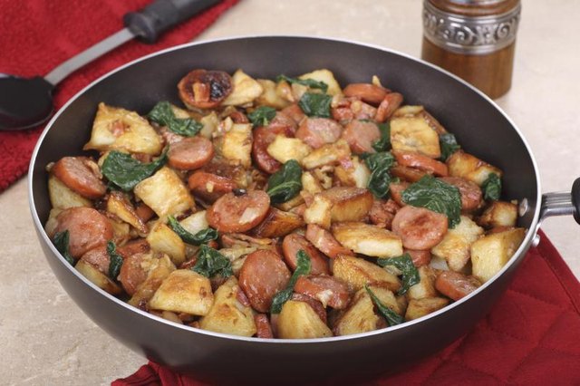 Sausage and potatoes in a pan.