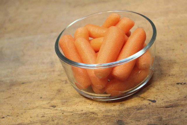 Bowl filled with baby carrots.