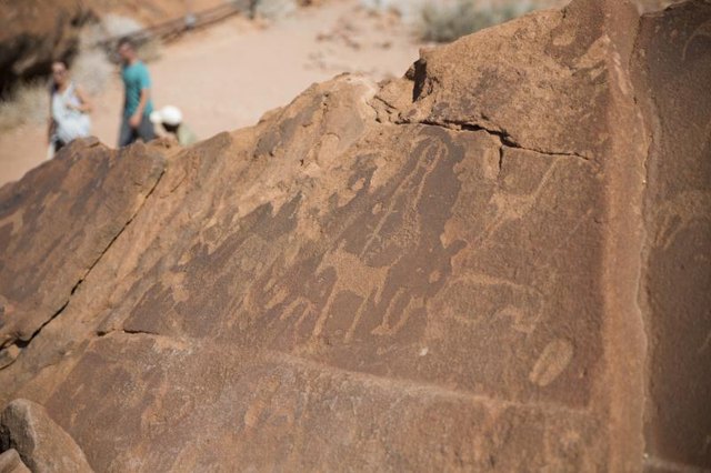 Historic petroglyphs on the entrance of a cave.