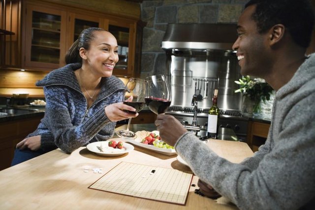 A couple toast with red wine