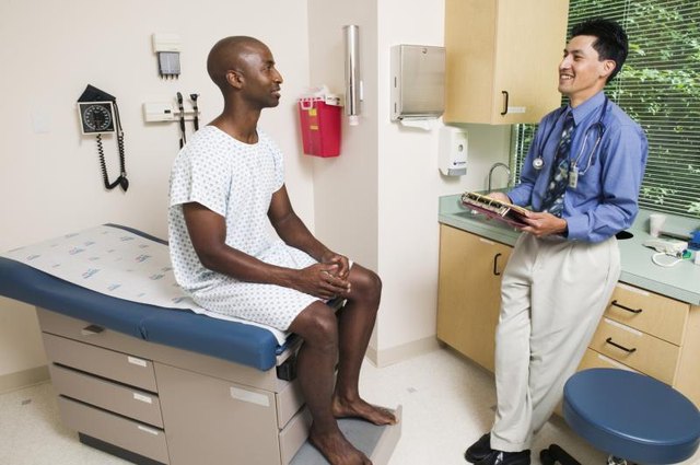 Doctor and patient talking in office.