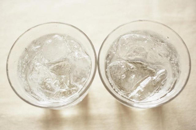 Two carbonated sodas on tabletop.