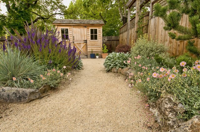 A dirt path looks adds charm to a cottage garden.